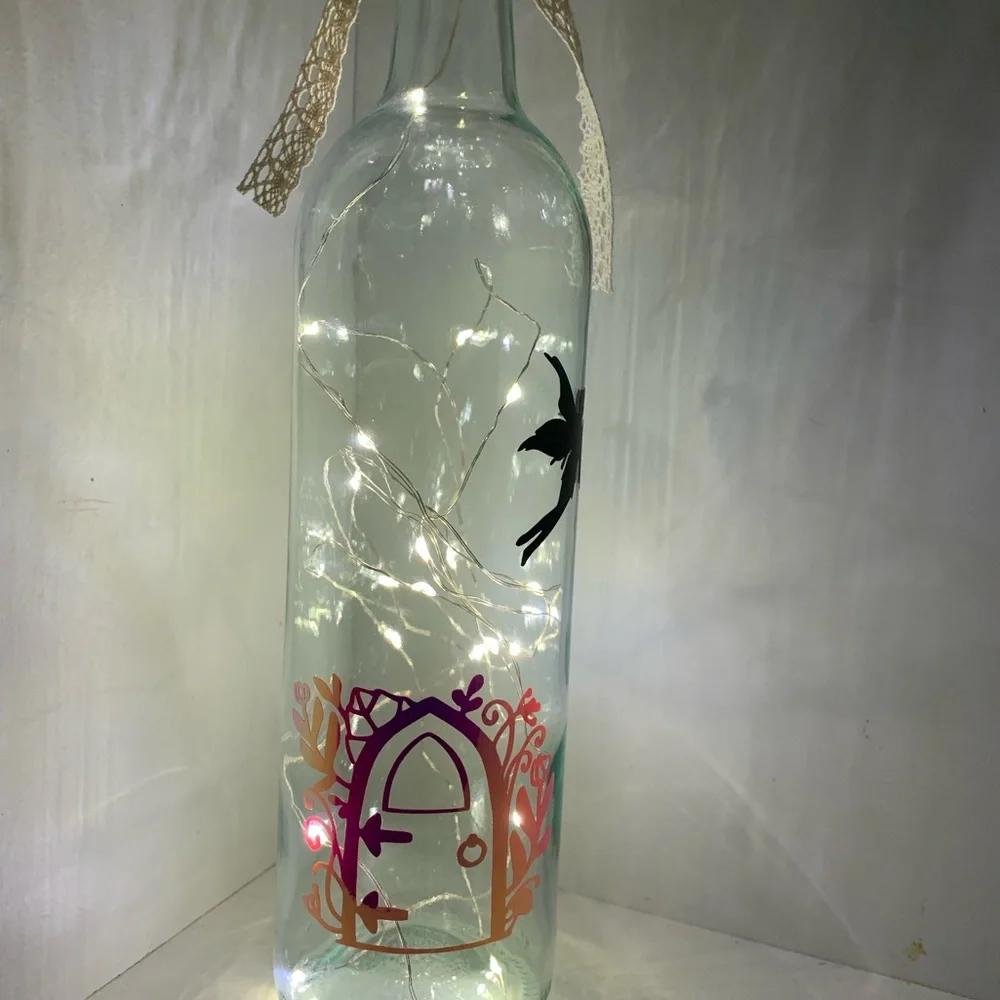 Fairy door lighted wine bottle